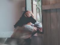 girl looking out window